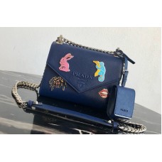 Prada Saffiano Leather Prada Monochrome Bag with appliqués in Blue Saffiano leather Prada Saffiano Leather Prada Monochrome Bag with appliqués in Blue Saffiano leather